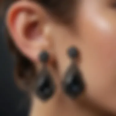 Close-up view of real black diamond earrings showcasing their intricate design