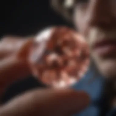 An expert evaluating a color diamond under controlled lighting conditions