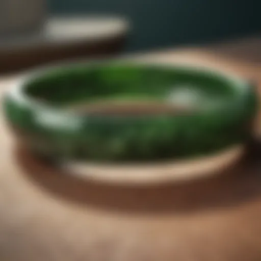 A close-up view of a beautifully polished jade bangle showcasing its deep green hues