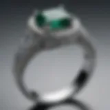 A close-up view of a Vera Wang emerald engagement ring showcasing the intricate band design.