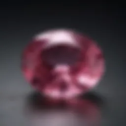 A stunning unheated pink sapphire displayed on a velvet background